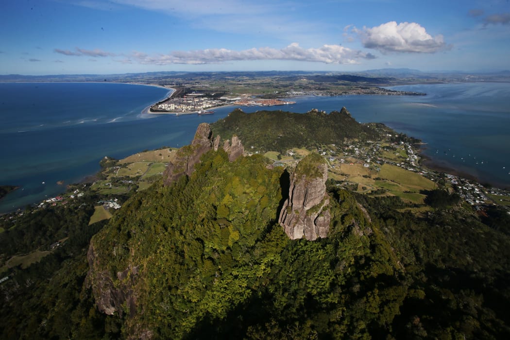 Mount Manaia with the Marsden Point oil refinery at the entrance to Whangarei Harbour in the background.
