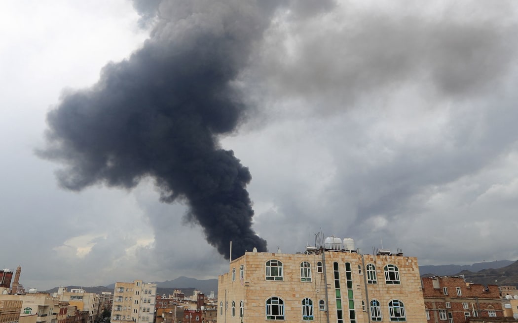 Smoke billows after an Israeli airstrike on Yemen's Houthi-held capital Sanaa on 24 August.