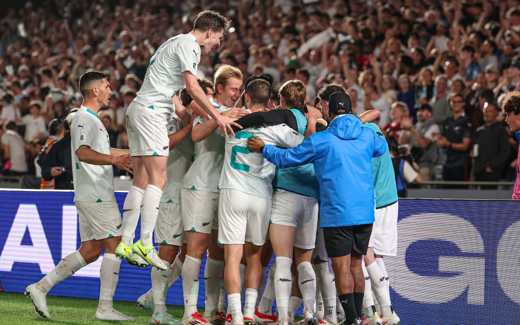 The All Whites celebrate their victory.