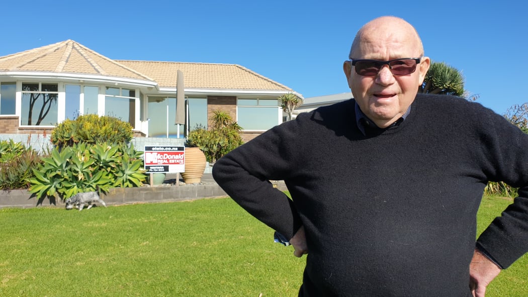 George Corlett outside his Onaero home.