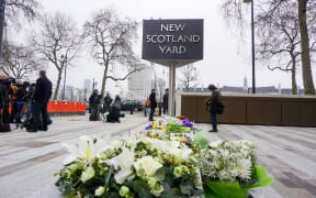 A tribute to the victims of the attack left at Scotland Yard.