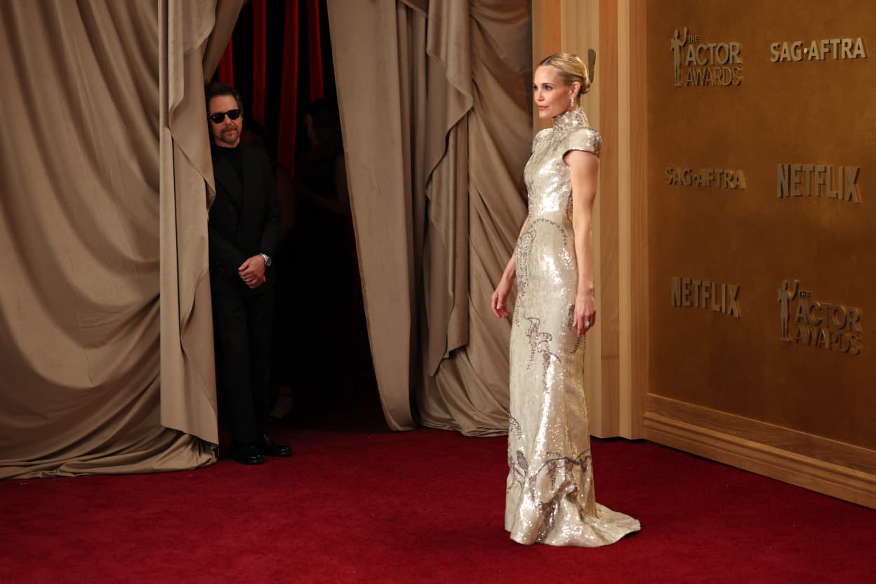 US actor Sam Rockwell and US actress Leslie Bibb attend the 32nd Annual Actor Awards at the Shrine Auditorium in Los Angeles on March 1, 2026. (Photo by Patrick T. Fallon / AFP)