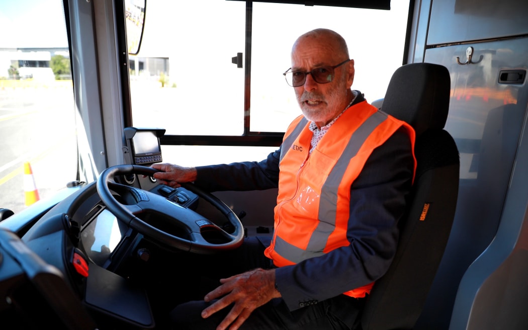 Auckland Mayor Wayne Brown tries out a new electric double decker bus