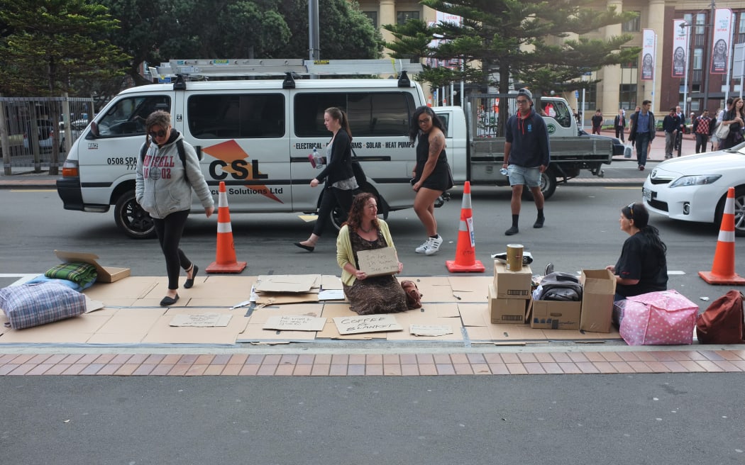 For Wellington Parking Day: ‘Coffee and a Blanket’. Coffee and blankets were gathered for a Wellington Soup Kitchen. Visitors could make a sign and see how the public reacted. Most were shaken by the way they were immediately shunned, says Harfleet.
