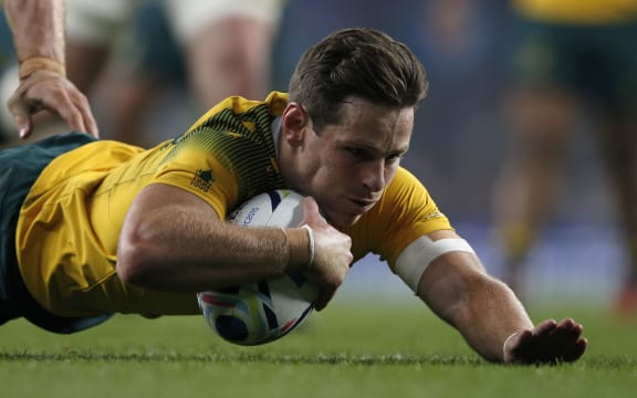 Australia first-five Bernard Foley scores his team's second try during a Pool A match of the 2015 Rugby World Cup between England and Australia at Twickenham stadium, south west London, on October 3, 2015