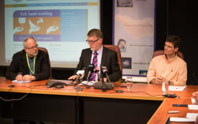 District Health Board chief executive Kevin Snee (center) - with Dr David Sinclair (left) and Dr Andrew Burns (right) - talking to media. 19 August 2016.