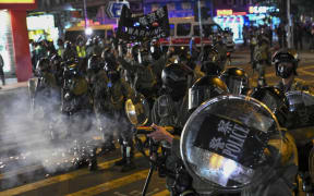 Police fire tear gas during a protest at Hung Hom area in Hong Kong on December 1, 2019.