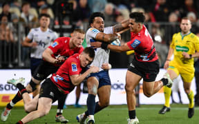 Pepesana Patafilo of Moana Pasifika is tackled by Dallas McLeod of the Crusaders and Noah Hotham of the Crusaders at the Apollo Projects Stadium, Christchurch, on 31 May, 2024.