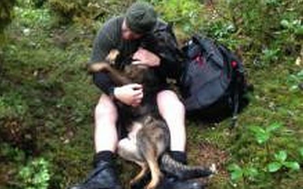 Thames and his dog handler