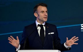 French President Emmanuel Macron speaks during the Saudi-French Business Forum during an official visit in Riyadh on December 3, 2024. (Photo by JEANNE ACCORSINI / POOL / AFP)