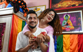 (FILES) In this picture taken on August 30, 2023, Surendra Pandey (L) and Maya Gurung, a transgender woman, take part in an interview with AFP in Kathmandu. An LGBTQ couple has acquired a marriage certificate in Nepal, officials said on November 30, a first in South Asia and hailed by the pair as a win "for all". Transgender woman Maya Gurung and Surendra Pandey obtained a marriage certificate from a local ward in Nepal's Lamjung district the previous day. (Photo by Prakash MATHEMA / AFP)