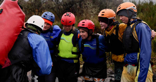 Year 11 Outdoor Ed students from Ellesmere College getting a river crossing pep-talk from their instructor.