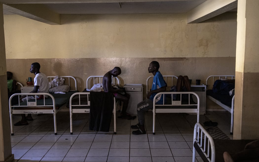 Recovering Kush addicts sit on their beds at the Kissy Mental Hospital in Freetown on 22 June, 2023.