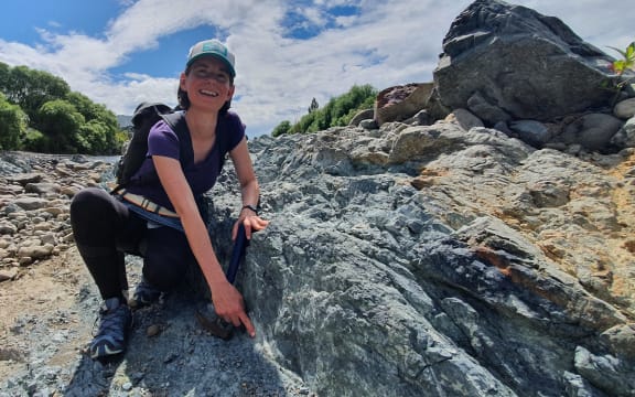 Dr. Carolyn Boulton next to the slipping zone on part of the Wellington Fault