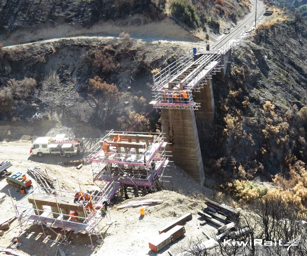 Crews repair a bridge on the track between Springfield and Cass following a 300 ha fire on Waitangi weekend.