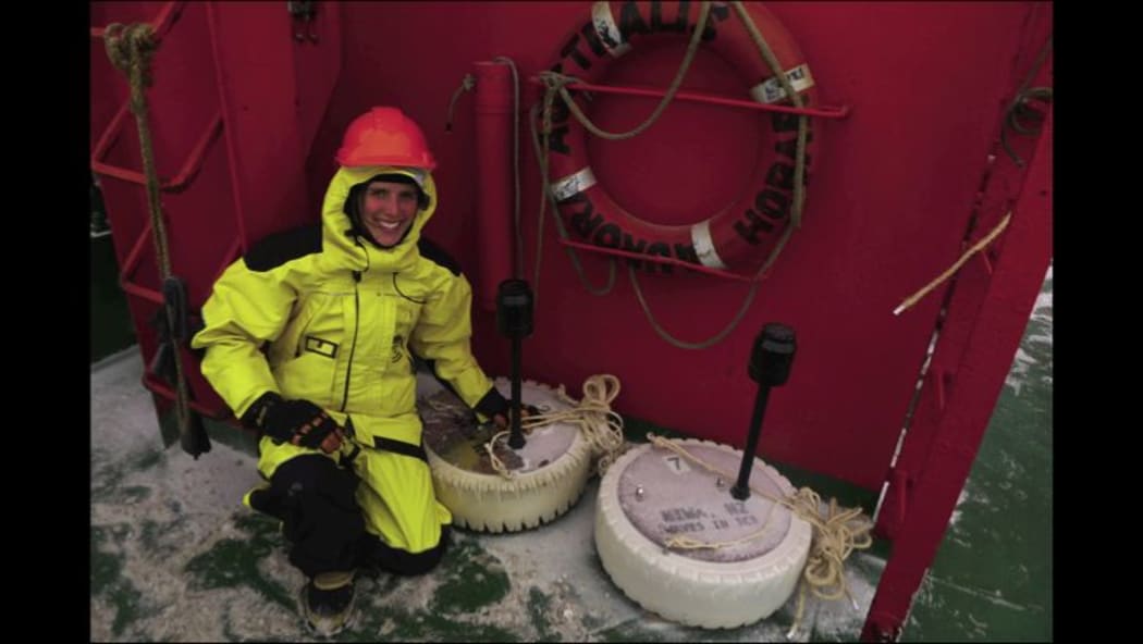 NIWA scientist Alison Kohout with two of the wave sensors, ready to be deployed onto the ice.