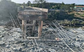 This handout photo taken and released by Agence Kampuchea Press (AKP) on December 13, 2025 shows a damaged bridge after Thai military strikes in Pursat province, amid clashes along the Cambodia-Thailand border. Violence between the Southeast Asian neighbours, which stems from a long-running dispute over the colonial-era demarcation of their 800-kilometre (500-mile) border, has displaced around half a million people on both sides. (Photo by AKP / Agence Kampuchea Press (AKP) / AFP) / RESTRICTED TO EDITORIAL USE - MANDATORY CREDIT "AFP PHOTO / AGENCE KAMPUCHEA PRESS (AKP) " - HANDOUT - NO MARKETING NO ADVERTISING CAMPAIGNS - DISTRIBUTED AS A SERVICE TO CLIENTS
