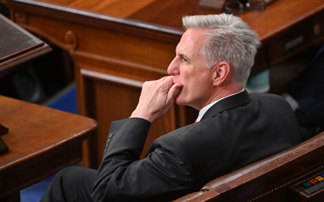 US Republican Representative Kevin McCarthy listens before the House of Representatives votes for a seventh time for a new speaker at the US Capitol in Washington, DC, January 5, 2023. - The House adjourned until Thursday as bitter infighting within the Republican ranks continues to paralyze the chamber and prevent the election of a new speaker. (Photo by MANDEL NGAN / AFP)