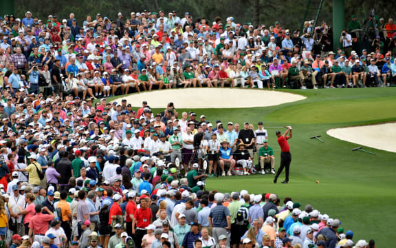 Tiger Woods hits his tee shot on the 3rd hole during the final round of the 2019 Masters golf tournament at Augusta National Golf Club.