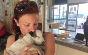 Angela Glover with a rescued puppy.