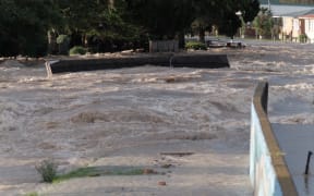 A concrete section of the Rangitāiki River stopbank resting in the middle of College Rd, Edgecumbe, after the town flooded on Thursday 6 April 2017.