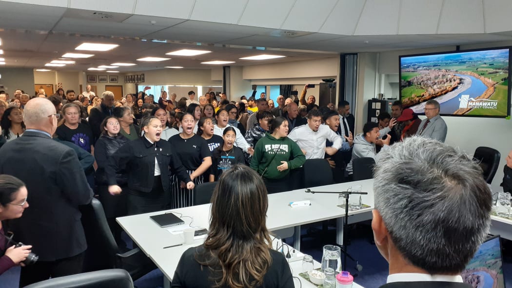 Rangatahi surged to the council table to perform a haka following the Manawatū District Council's decision in Feilding today to revoke an earlier decision against bringing in Māori wards for 2022.
