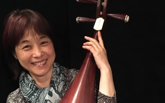 Wu Man and her pipa with a redwood belly