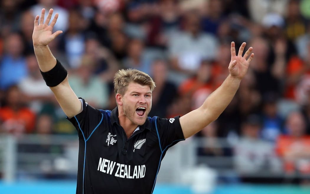New Zealand bowler Corey Anderson celebrates South African batsman Faf du Plessis being caught by New Zealand keeper Luke Ronchi.
