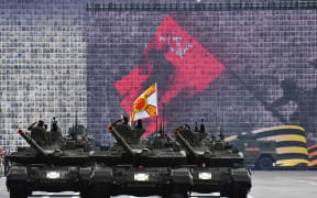 Russian military vehicles move on Dvortsovaya Square during the general rehearsal of the Victory Day military parade in central Saint Petersburg on May 7, 2025. Russia will celebrate the 80th anniversary of the Soviet Union's victory over Nazi Germany in World War Two (WWII) on May 9. (Photo by Olga MALTSEVA / AFP)