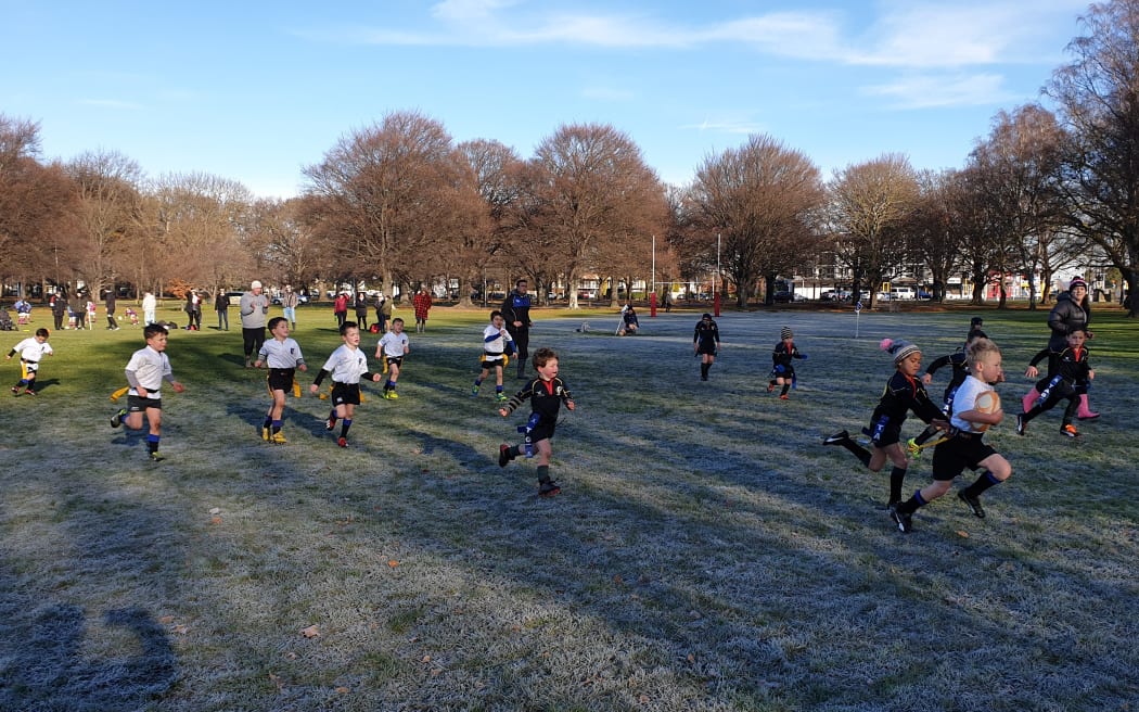 Children brave the cold in Hagley Park after coldest night so far this winter in Christchurch.