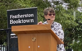 Joy Cowley addressing hundreds of Wairarapa locals at the blessing of the playground named after her.