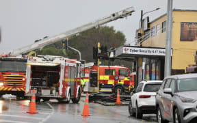 A section of road in Blockhouse Bay, Auckland has been closed after wind blew the roof off a commercial building and partially collapsed the front of the structure.