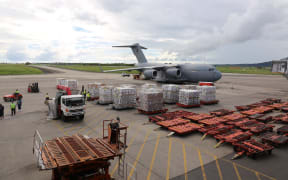 A C-17 aircraft from the Australian Air Force arrives with relief supplies.