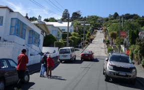 A constant stream of tourists travels up the world's steepest street, Dunedin's Baldwin Street, each day.