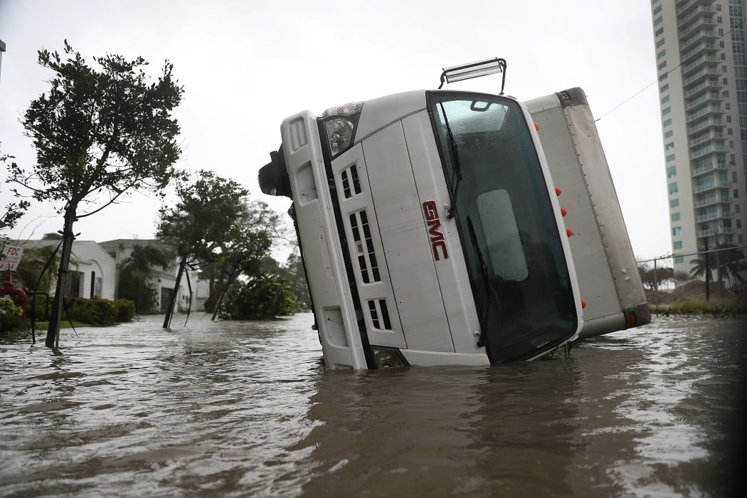 A truck is seen on its side after being blown over as Hurricane Irma passed through on September 10, 2017 in Miami, Florida.