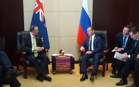 Prime Minister John Key meets with Russian Prime Minister Dmitry Medvedev at the East Asia Summit in Laos.