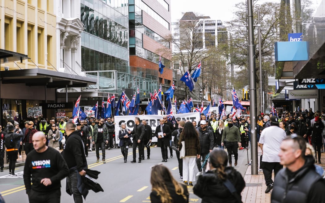 Brian and Hannah Tamaki seen during the anti-government protest in Wellington, marching towards Parliament on 23 August 2022.