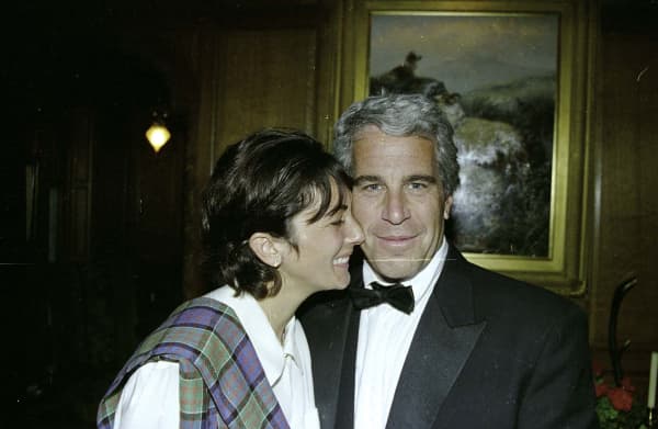 This undated trial evidence image obtained 8 December 2021, from the US District Court for the Southern District of New York shows British socialite Ghislaine Maxwell and US financier Jeffrey Epstein.