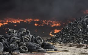 Tyres burn in an uncontrolled dump near the town of Sesena, Spain, after a fire brokeout early on May 13, 2016.