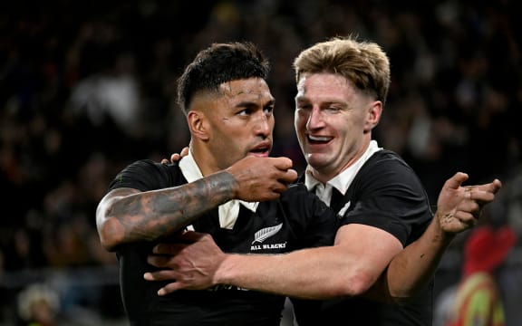 Rieko Ioane celebrates a try with Jordie Barrett.