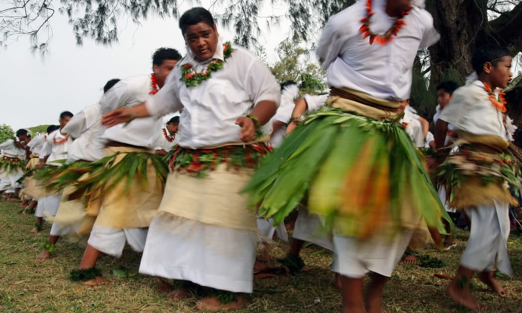 Tongan youth dance wearing traditional ta'ovala or woven waist mats.