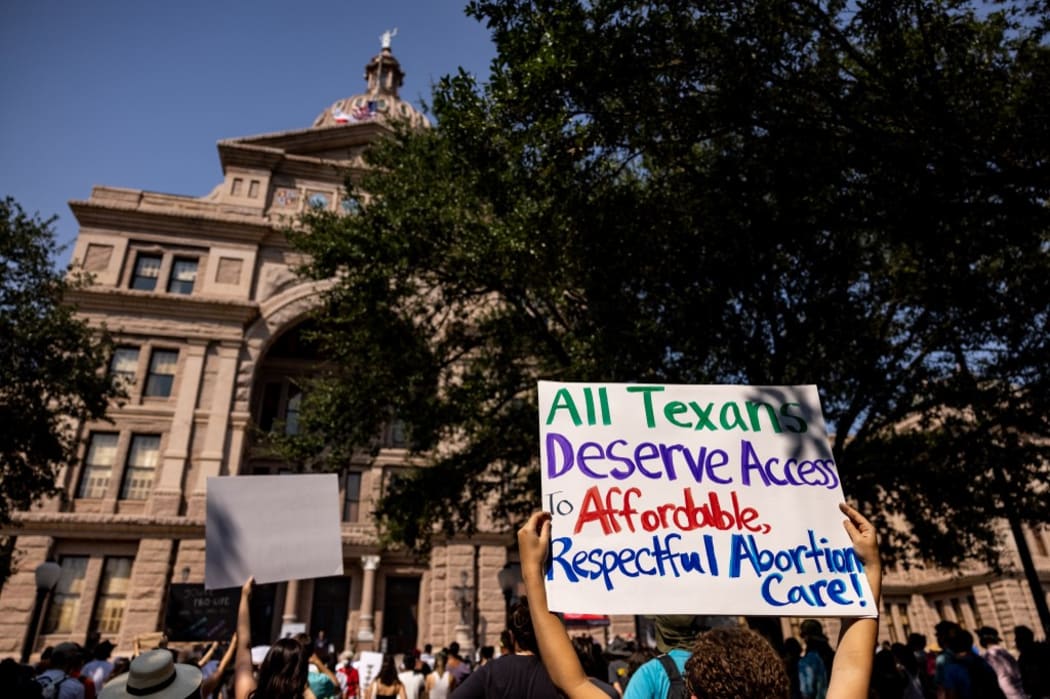 Abortion rights activists rally at the Texas State Capitol after lawmakers passed several pieces of conservative legislation, including SB8.