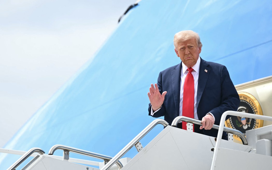 US President Donald Trump steps off Air Force One upon arrival at Luke Air Force Base in Glendale, Arizona on September 21, 2025 to attend the memorial for right-wing activist Charlie Kirk. (Photo by Mandel NGAN / AFP)