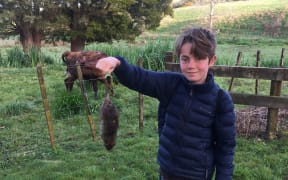 Hugo with one of the rats he's caught