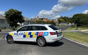 A police car on Douglas Crescent outside the address where a stabbing incident took place.
