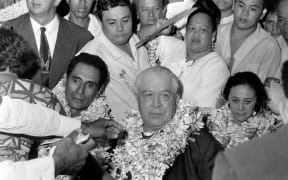 In this file picture taken in Papeete on December 9, 1968 French Polynesia politician and Tahitian nationalist, Pouvanaa A Oopa is greeted with garlands after his return to French Polynesia following his pardon by then President Charles de Gaulle.