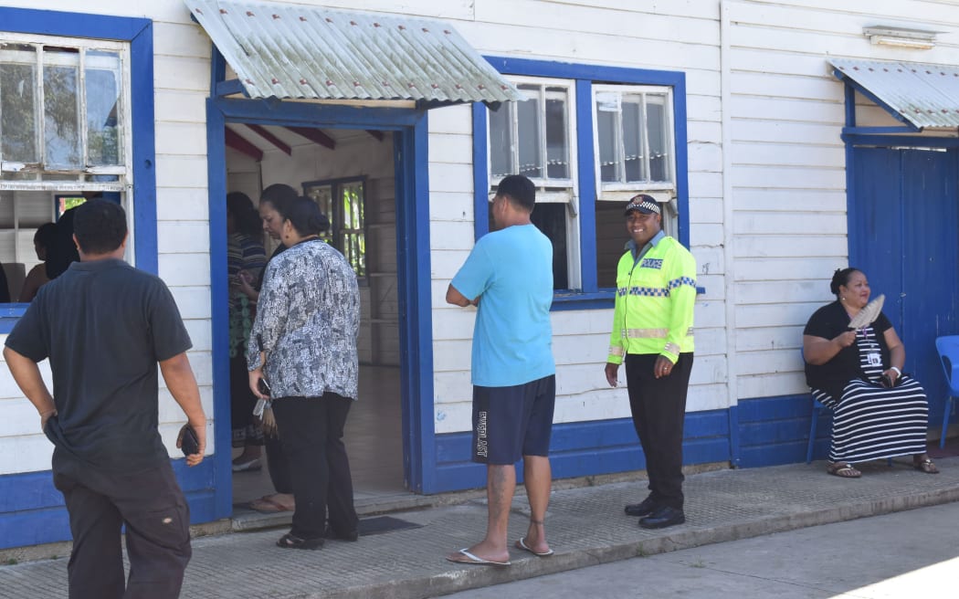 Early voters in Tonga's General Election wait in socially distanced queues at the FWC church hall at Ngele'ia. Nuku'alofa, 18 November 2021
