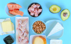 Ketogenic food. Low-carb food including, fish, meat, cheese, nuts, oil and butter. (Photo by WLADIMIR BULGAR/SCIENCE PHOTO LI / WBU / Science Photo Library via AFP)