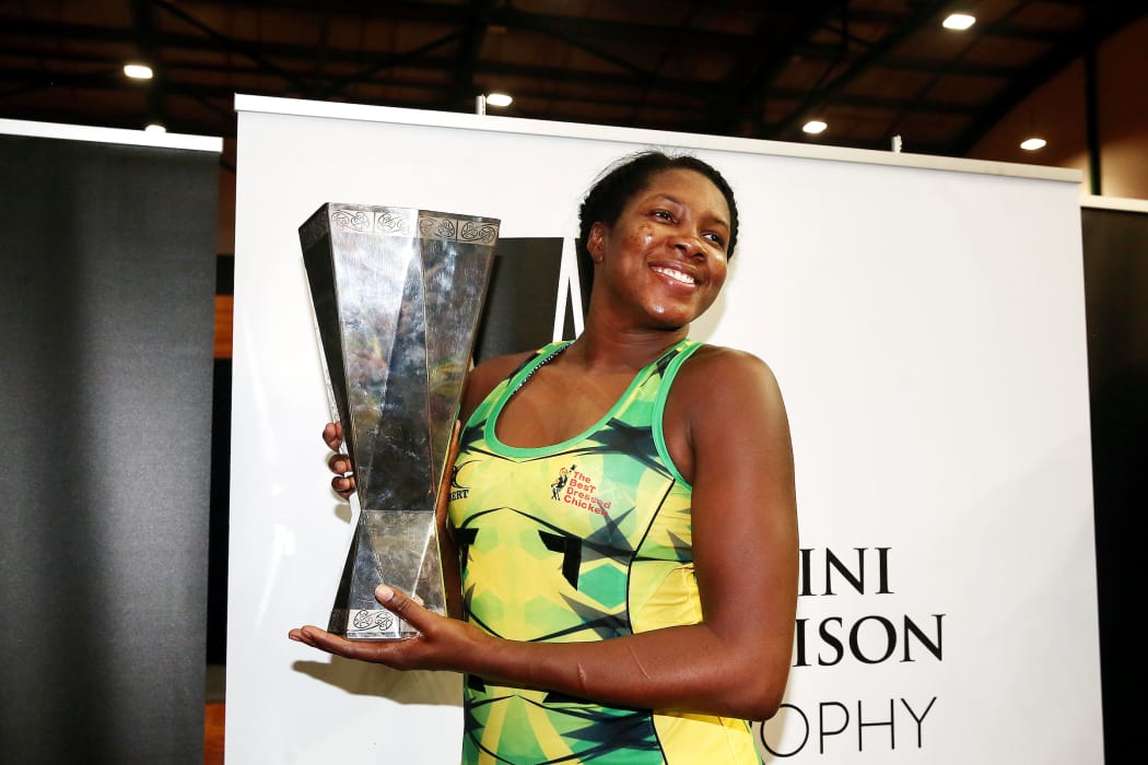 Jhaniele Fowler Reid of Jamaica celebrates with the Taini Jamison Trophy after winning the final against the Silver Ferns.