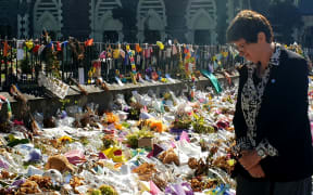 UN deputy high commissioner for human rights Kate Gilmore at the wall of flower tributes offered to victims of the Christchurch terror attacks.